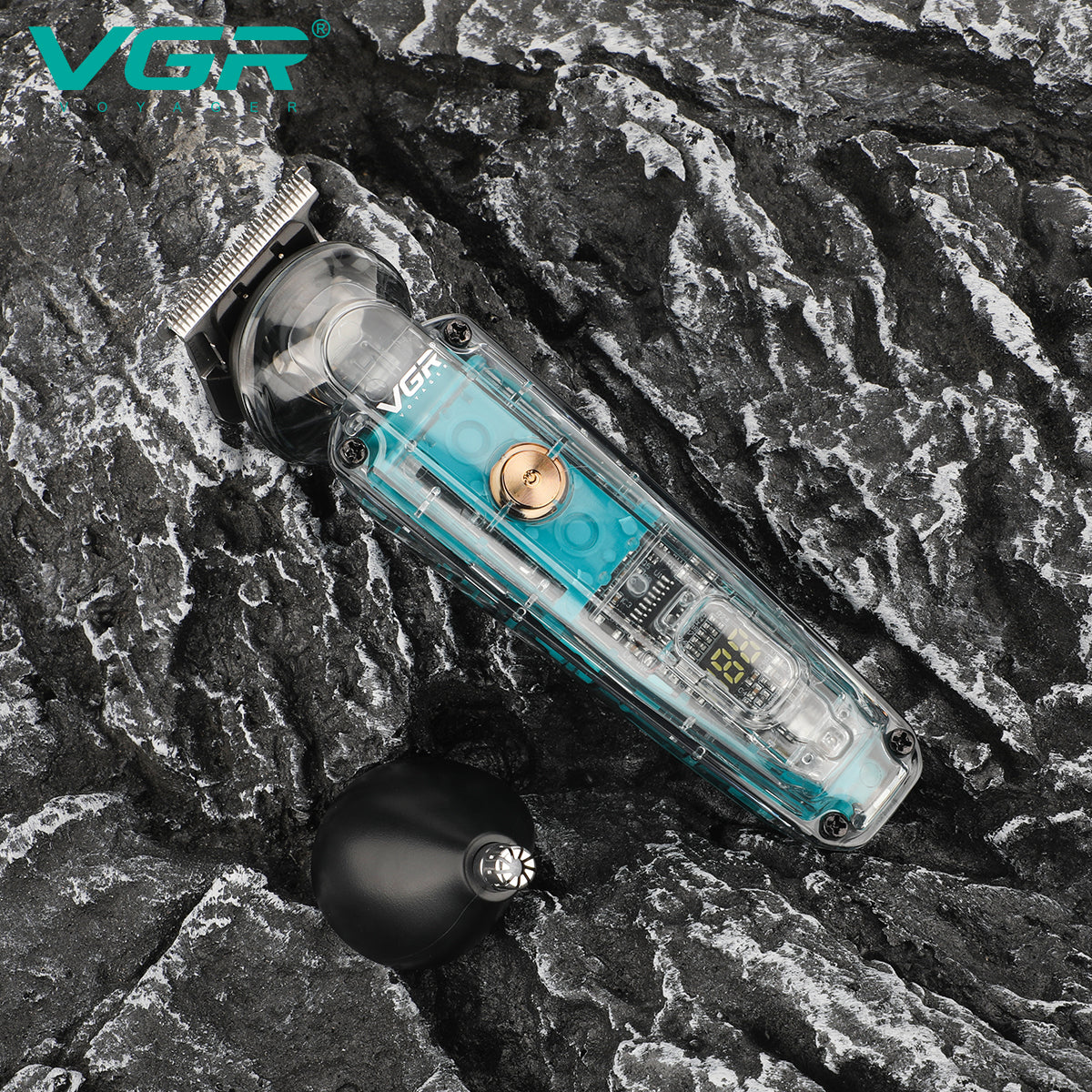 VGR V-949 transparent 2-in-1 hair and nose trimmer lying on dark textured rock with interchangeable nose trimmer head attachment