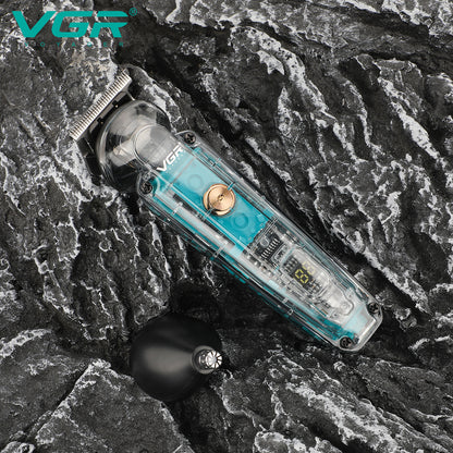 VGR V-949 transparent 2-in-1 hair and nose trimmer lying on dark textured rock with interchangeable nose trimmer head attachment