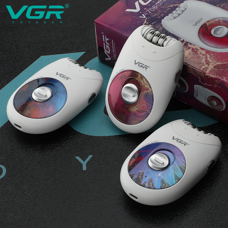 Three white VGR V-706 epilators featuring different pink, purple, and geometric graphic faceplates next to product box