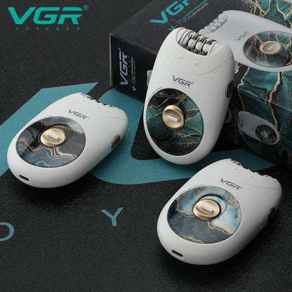 Three white VGR V-706 lady epilators displaying green marble and blue wave graphic accents beside packaging box