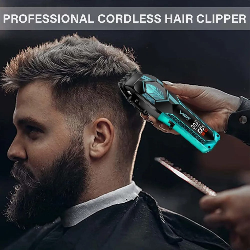 Close-up view of a barber's hands using the black and green VGR V-119 professional cordless hair clipper to perform a tight taper fade cut on a male client with short, styled hair.