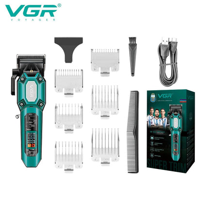 VGR V-600 transparent body hair trimmer in emerald green color variant displayed with complete attachment combs, cleaning brush, and original packaging box.