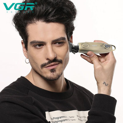 side profile view of a bearded man using the cordless gold vgr v-978 vintage trimmer to precisely detail and shape his hairline demonstrating the ergonomic design and close cutting performance of the professional hair clipper