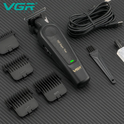vgr v-995 cordless hair clipper laying down with four cutting guide combs cleaning brush and blade oil