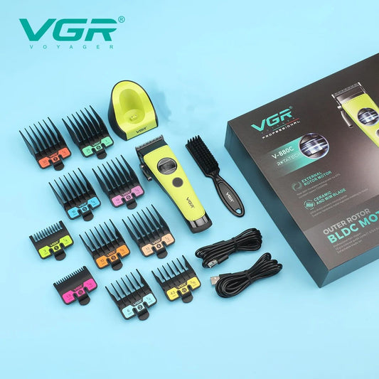 Complete VGR V-880C hair clipper kit displaying retail packaging, charging base, cleaning brush, USB cables, and 10 guide combs.